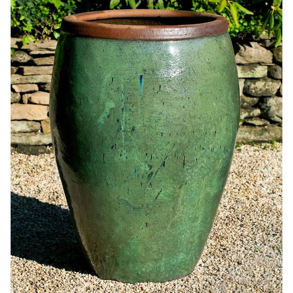 Large green glazed planter with a contrasting brown rim